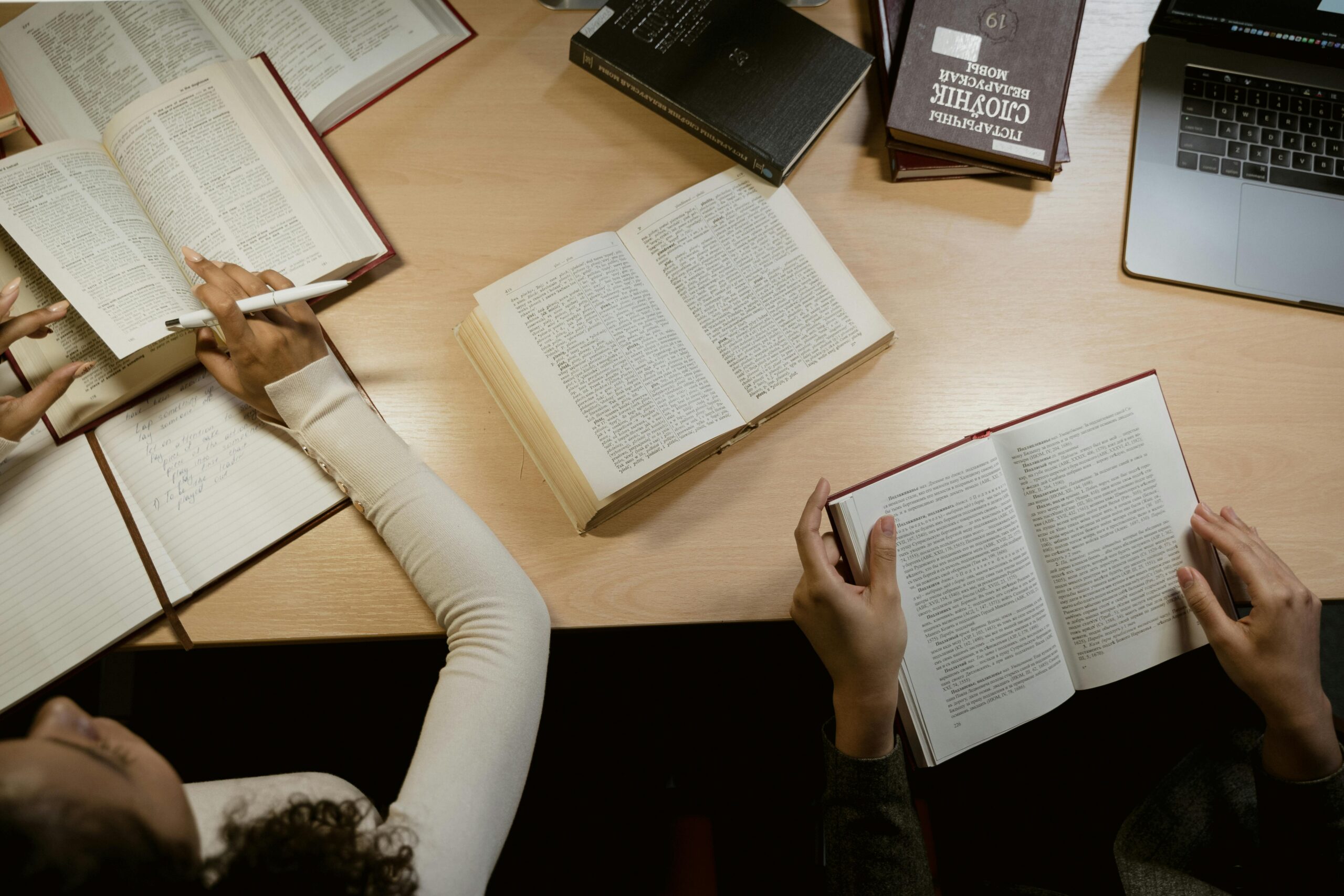Counsellor studying with books on the table.